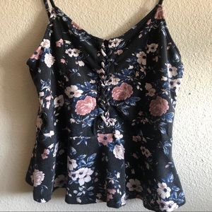 Black floral flair crop top with a lace up design